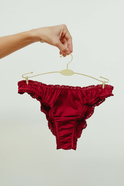 The burgundy frilly panties