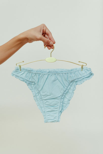 The pastel blue frilly panties